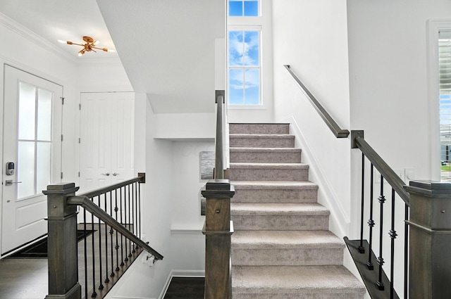 1877 Poplar Pl, Lewis Center, OH 43035 - stairs with healthy amount of natural light, wood finished floors, and crown molding
