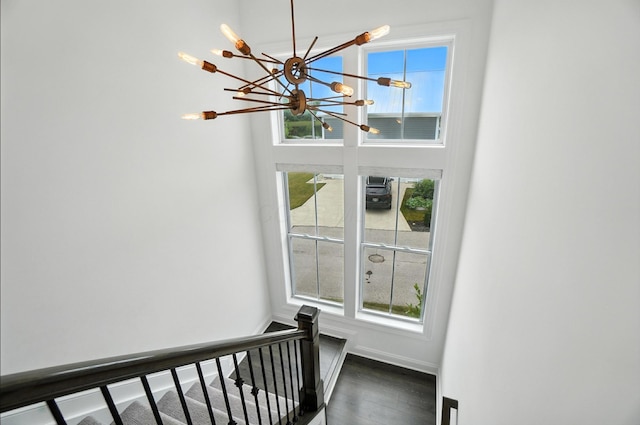 1877 Poplar Pl, Lewis Center, OH 43035 - staircase featuring a chandelier, plenty of natural light, and wood finished floors