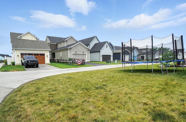 1877 Poplar Pl, Lewis Center, OH 43035 - view of green lawn with a trampoline and a residential view
