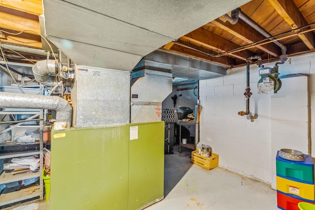910 Pauline Ave, Columbus, OH 43224 - unfinished basement featuring concrete block wall and heating unit