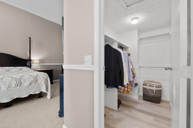 4758 Crazy Horse Ln Unit 2, Westerville, OH 43081 - bedroom featuring a textured ceiling and light wood-style flooring