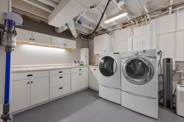 4758 Crazy Horse Ln Unit 2, Westerville, OH 43081 - laundry room with cabinet space and washer and clothes dryer