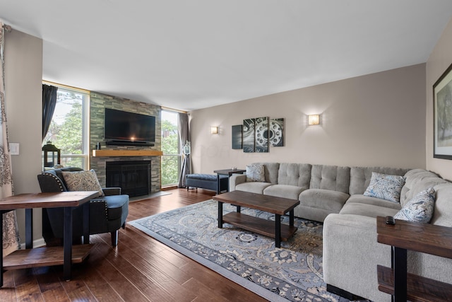 4758 Crazy Horse Ln Unit 2, Westerville, OH 43081 - living room featuring plenty of natural light, dark wood-type flooring, a stone fireplace, and expansive windows