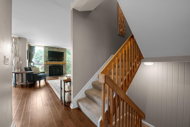 4758 Crazy Horse Ln Unit 2, Westerville, OH 43081 - stairway featuring a stone fireplace and wood-type flooring
