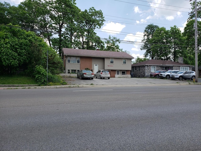 5100 Cleveland Ave, Columbus, OH 43231 - view of front of home featuring uncovered parking and brick siding