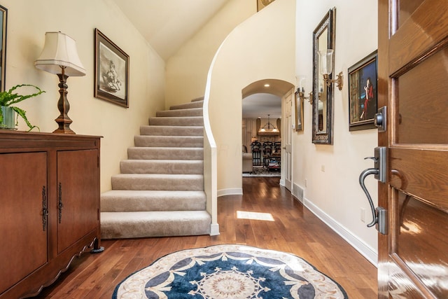 161 Jackson St, Columbus, OH 43206 - foyer entrance featuring hardwood / wood-style flooring, arched walkways, stairs, and lofted ceiling