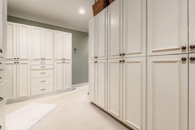 161 Jackson St, Columbus, OH 43206 - hallway with crown molding, light colored carpet, and recessed lighting