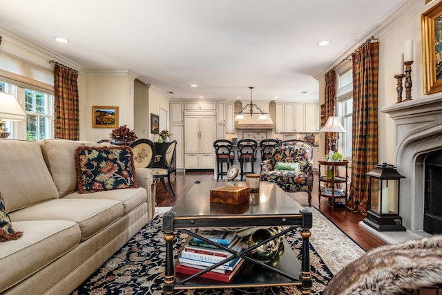 161 Jackson St, Columbus, OH 43206 - living area with dark wood-style flooring, recessed lighting, and ornamental molding