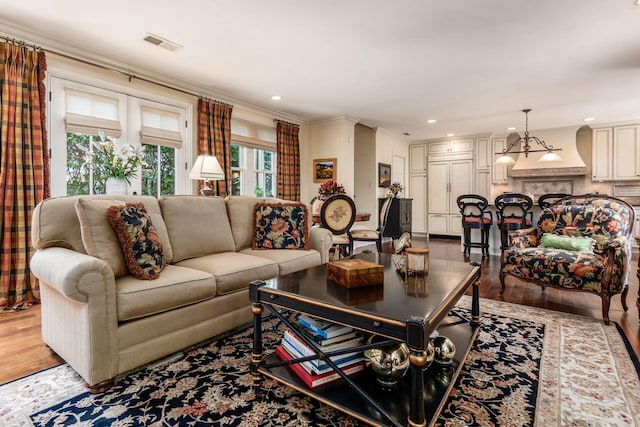 161 Jackson St, Columbus, OH 43206 - living area with wood finished floors, ornamental molding, and recessed lighting