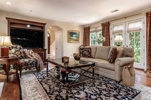 161 Jackson St, Columbus, OH 43206 - living room with hardwood / wood-style flooring, arched walkways, ornamental molding, and recessed lighting