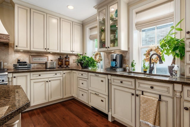 161 Jackson St, Columbus, OH 43206 - kitchen featuring cream cabinets, plenty of natural light, dark wood finished floors, and recessed lighting