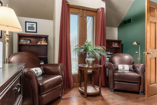 161 Jackson St, Columbus, OH 43206 - sitting room featuring plenty of natural light, lofted ceiling, and wood finished floors