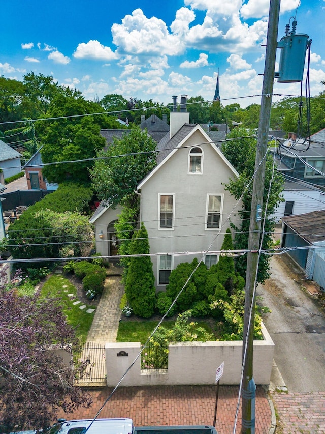 161 Jackson St, Columbus, OH 43206 - view of property exterior with a fenced front yard, a gate, and a chimney