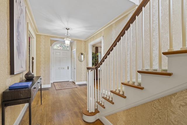 130 Boving Rd, Lancaster, OH 43130 - foyer with wood finished floors, stairs, ornamental molding, and a chandelier
