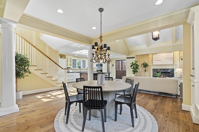 130 Boving Rd, Lancaster, OH 43130 - dining room with crown molding, a chandelier, a high end fireplace, recessed lighting, and decorative columns