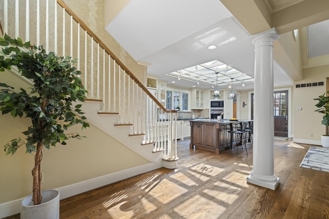 130 Boving Rd, Lancaster, OH 43130 - foyer entrance featuring decorative columns, wood-type flooring, stairway, recessed lighting, and ornamental molding