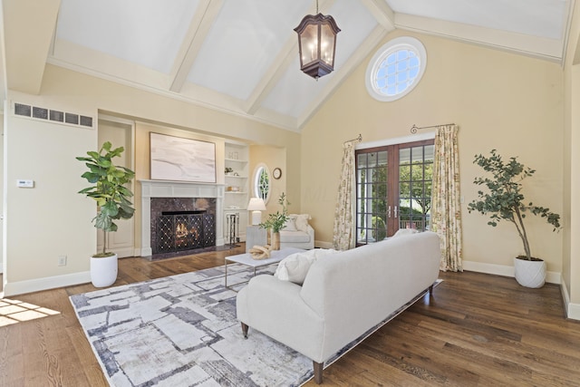 130 Boving Rd, Lancaster, OH 43130 - living area featuring built in features, wood finished floors, beam ceiling, high vaulted ceiling, and a fireplace