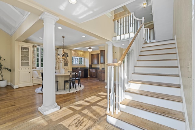 130 Boving Rd, Lancaster, OH 43130 - staircase with ornate columns, crown molding, wood finished floors, and recessed lighting