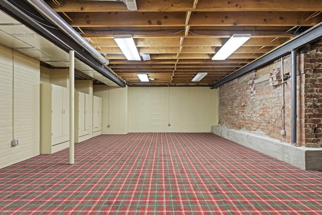 130 Boving Rd, Lancaster, OH 43130 - unfinished basement featuring brick wall and carpet floors