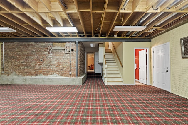 130 Boving Rd, Lancaster, OH 43130 - basement with brick wall, carpet floors, and stairs