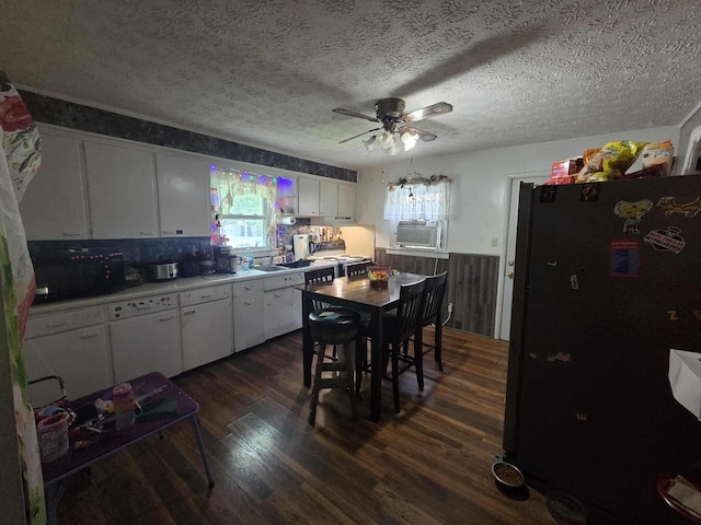 108 N George St, Lancaster, OH 43130 - kitchen with freestanding refrigerator, a ceiling fan, dark wood finished floors, white cabinetry, and cooling unit