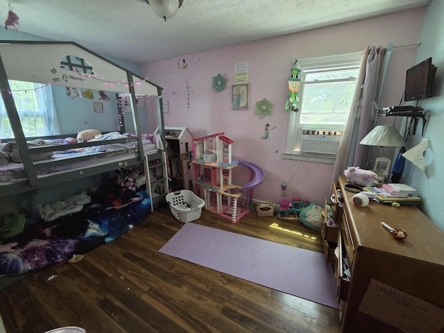 108 N George St, Lancaster, OH 43130 - bedroom with wood finished floors, a textured ceiling, and cooling unit