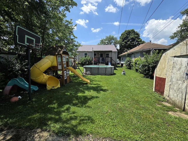 108 N George St, Lancaster, OH 43130 - view of green lawn with a playground and an outdoor pool
