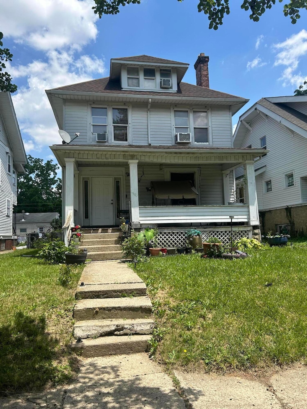 100 Eldon Ave, Columbus, OH 43204 - traditional style home featuring a porch, a chimney, and cooling unit