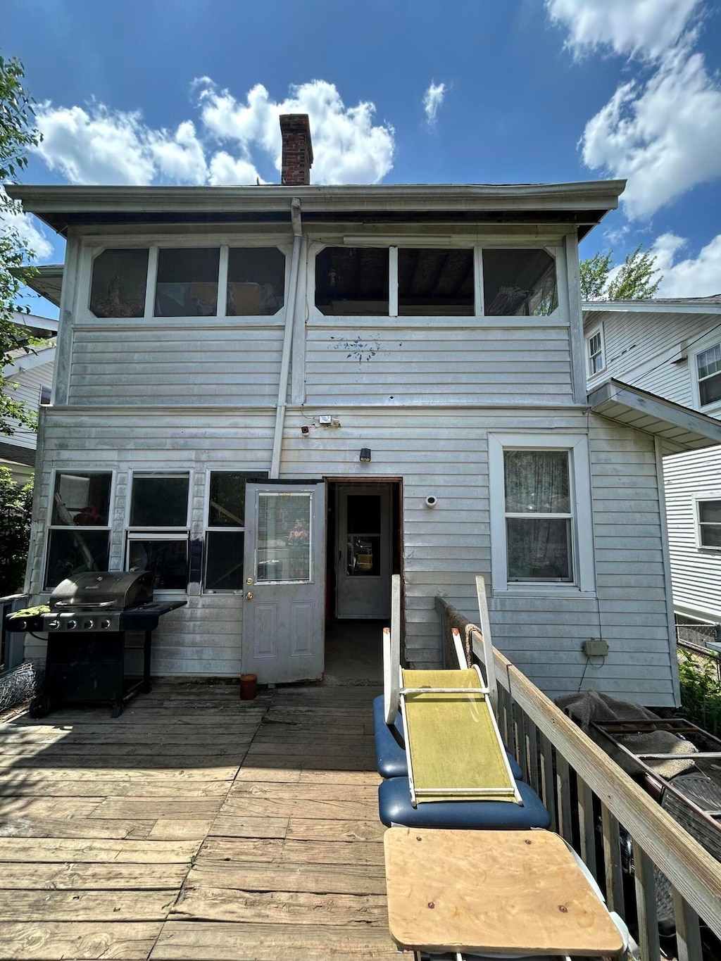 100 Eldon Ave, Columbus, OH 43204 - back of house with a wooden deck and a chimney