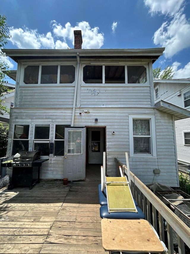 100 Eldon Ave, Columbus, OH 43204 - back of house with a wooden deck and a chimney