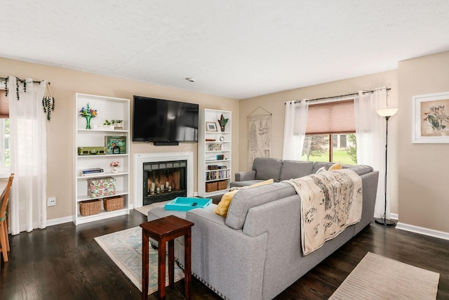 2328 Terrance Dr Unit 76, Columbus, OH 43220 - living room with a fireplace with raised hearth and dark wood finished floors