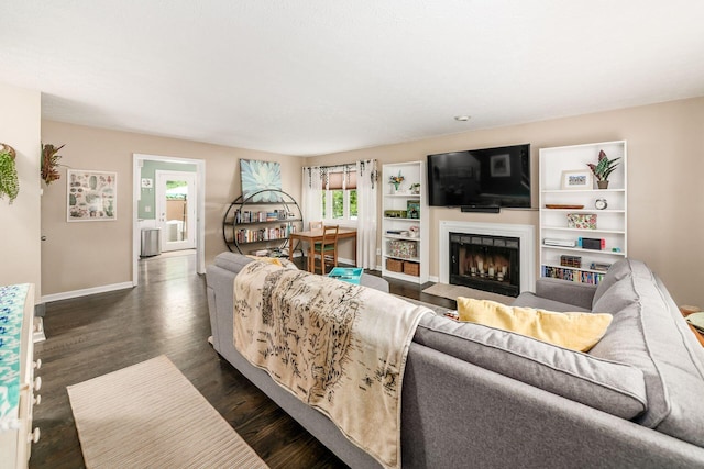 2328 Terrance Dr Unit 76, Columbus, OH 43220 - living area featuring a fireplace and dark wood-style flooring