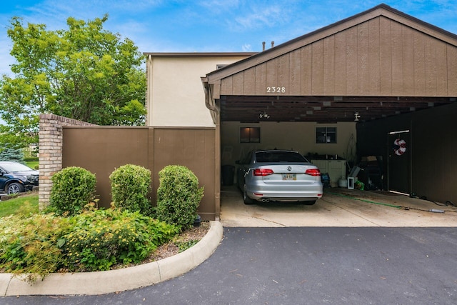 2328 Terrance Dr Unit 76, Columbus, OH 43220 - view of side of property with stucco siding and a garage