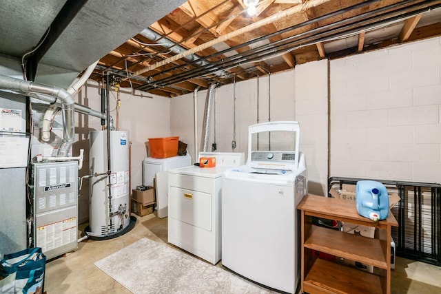 2328 Terrance Dr Unit 76, Columbus, OH 43220 - washroom with water heater, washer and clothes dryer, concrete block wall, and heating unit