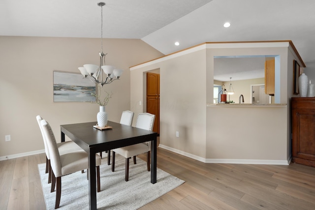 8090 Tree Lake Blvd, Powell, OH 43065 - dining area with a chandelier, light wood finished floors, lofted ceiling, and recessed lighting