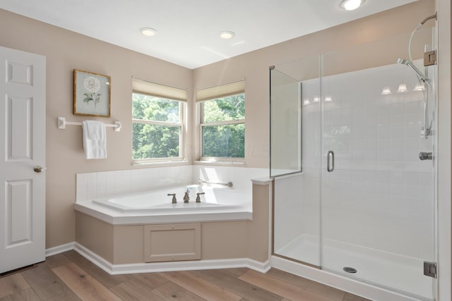 8090 Tree Lake Blvd, Powell, OH 43065 - full bathroom with a garden tub, a stall shower, wood finished floors, and recessed lighting