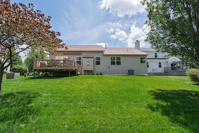 8090 Tree Lake Blvd, Powell, OH 43065 - back of house with a wooden deck, a yard, and a chimney