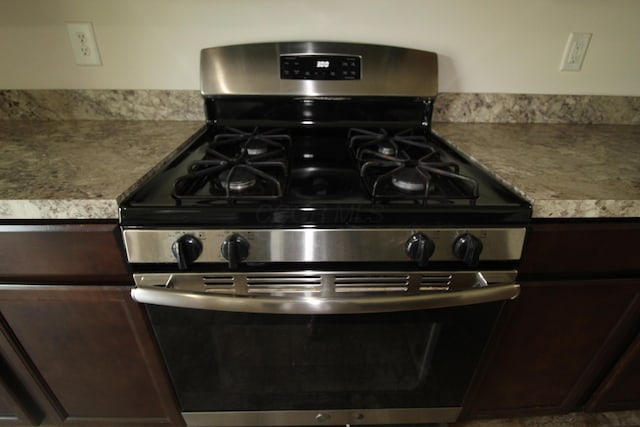 3348 Glasgow Dr, Groveport, OH 43125 - kitchen view of stainless steel gas range oven and dark brown cabinetry