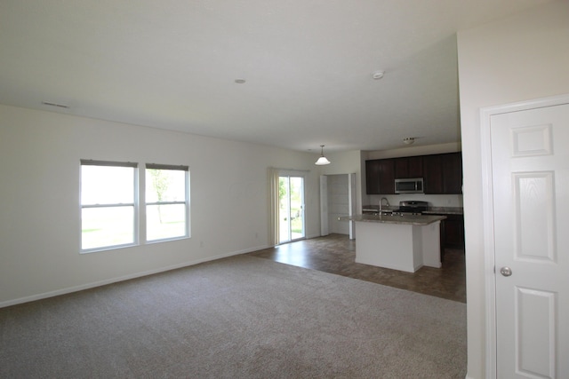 3348 Glasgow Dr, Groveport, OH 43125 - unfurnished living room featuring a sink and light colored carpet