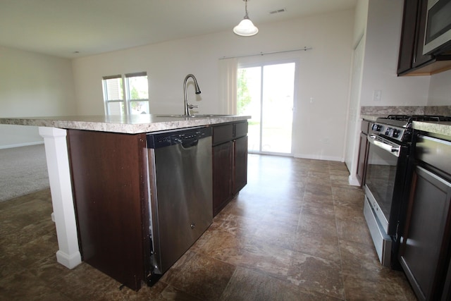 3348 Glasgow Dr, Groveport, OH 43125 - kitchen with stainless steel appliances, light countertops, dark brown cabinets, an island with sink, and pendant lighting