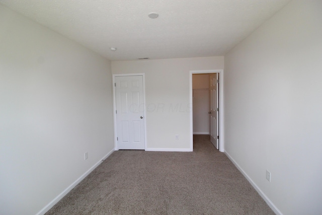 3348 Glasgow Dr, Groveport, OH 43125 - unfurnished bedroom with carpet, a spacious closet, and a closet