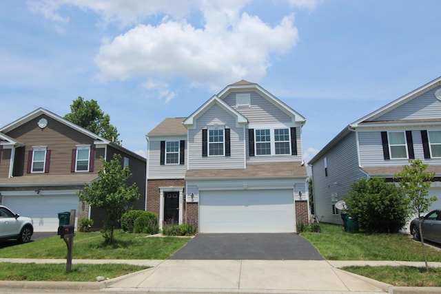 3348 Glasgow Dr, Groveport, OH 43125 - traditional home with a garage, brick siding, driveway, and a front lawn