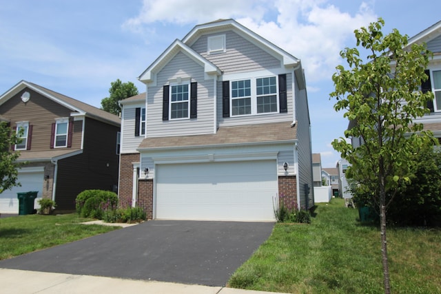 3348 Glasgow Dr, Groveport, OH 43125 - traditional home with brick siding, driveway, an attached garage, and a front yard