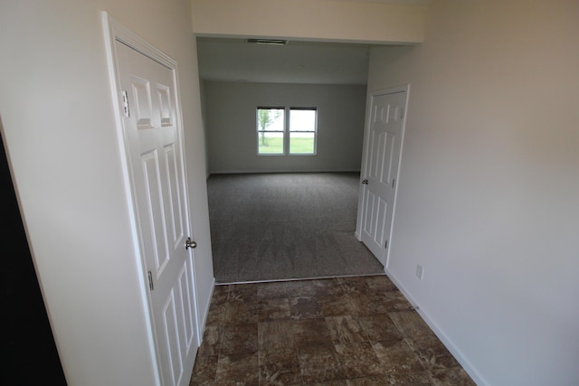 3348 Glasgow Dr, Groveport, OH 43125 - hallway featuring dark colored carpet and dark stone finish flooring