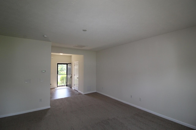 3348 Glasgow Dr, Groveport, OH 43125 - empty room featuring dark colored carpet and baseboards