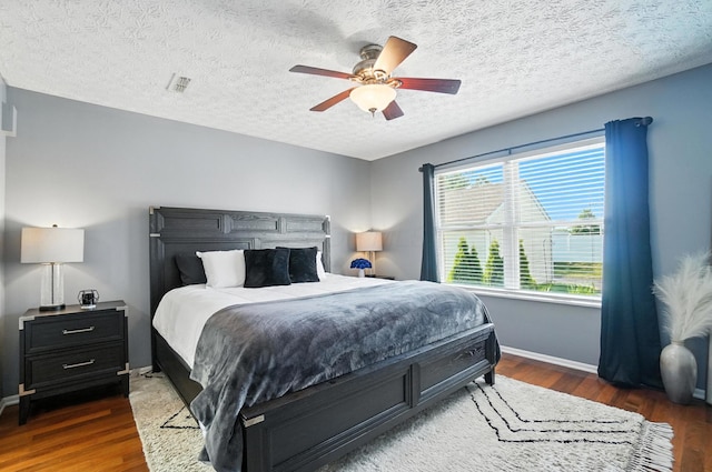 4764 Mattox St Unit 44, Columbus, OH 43228 - bedroom with wood finished floors, ceiling fan, and a textured ceiling