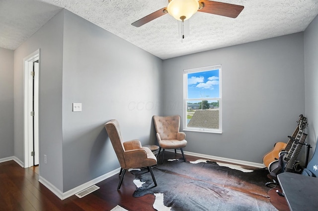 4764 Mattox St Unit 44, Columbus, OH 43228 - sitting room featuring dark wood-type flooring, a textured ceiling, and a ceiling fan