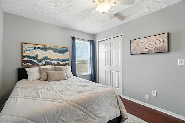 4764 Mattox St Unit 44, Columbus, OH 43228 - bedroom with dark wood-style floors, a closet, ceiling fan, a skylight, and a textured ceiling