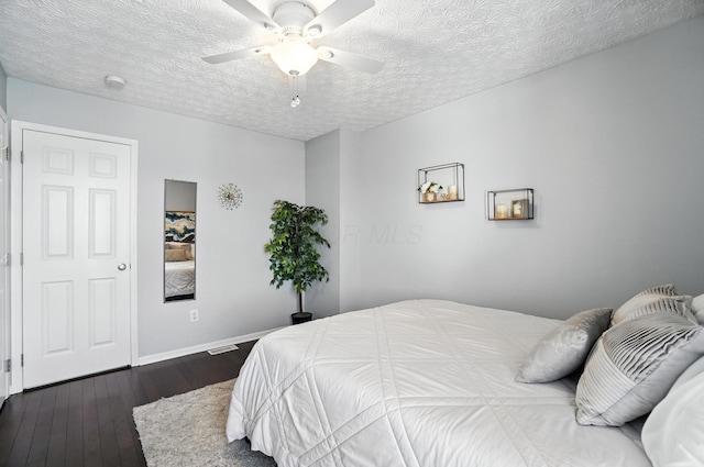 4764 Mattox St Unit 44, Columbus, OH 43228 - bedroom featuring dark wood finished floors, a textured ceiling, and ceiling fan