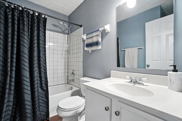 4764 Mattox St Unit 44, Columbus, OH 43228 - bathroom with vanity, shower / bathtub combination with curtain, and a textured ceiling